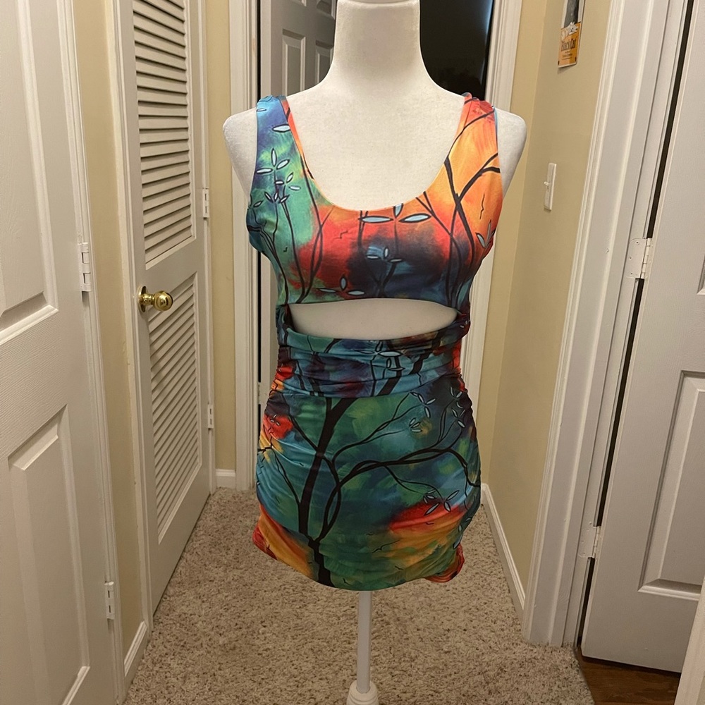 Tie Dye bodycon mini dress with peek-a-boo cutout.